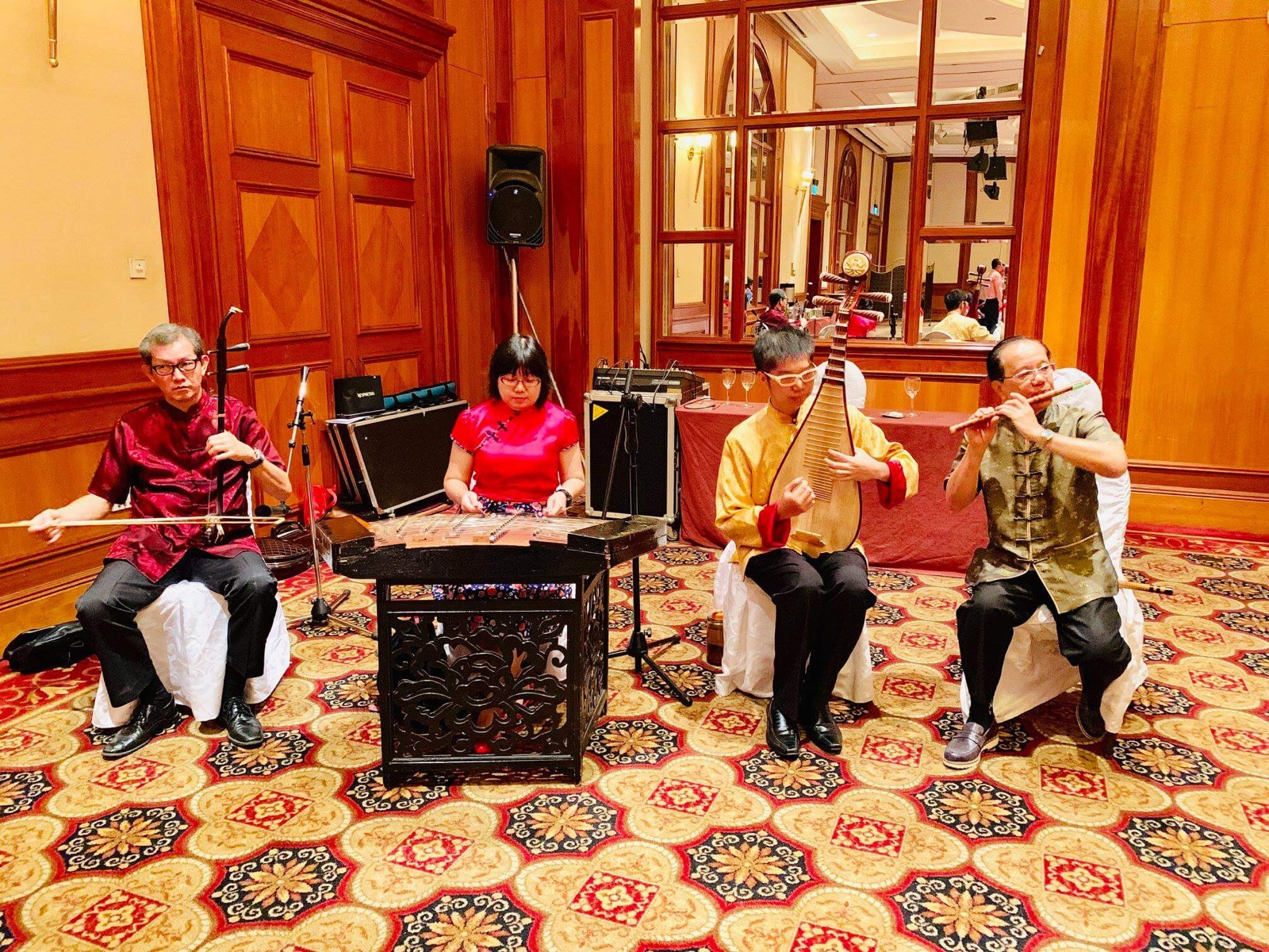 Nicholas Ng performing pipa with a Chinese chamber ensemble in Singapore