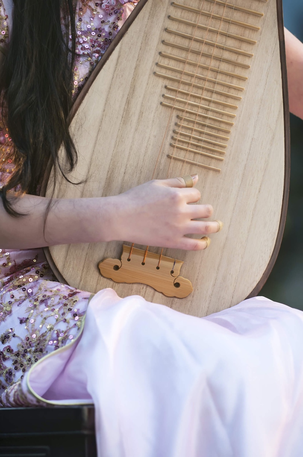 Close-up of hands playing the pipa